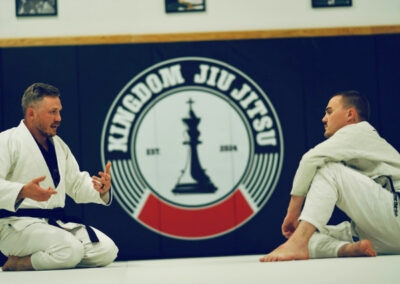 Coach Charlie of Kingdom Jiu-Jitsu in Yukon, Oklahoma talking to a student.