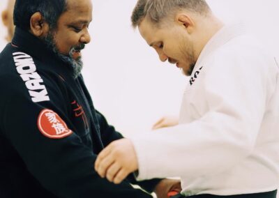 BJJ black belt Fredson Paixao awarding Charlie Hill with his black belt.