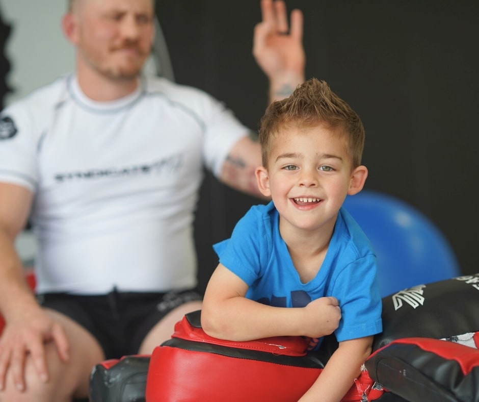 Young children participating in the Lambs to Lions Jiu-Jitsu class at Kingdom Jiu-Jitsu Academy in Yukon, Oklahoma.