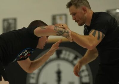 Wrestlers practicing Greco-Roman wrestling techniques during a class at Kingdom Jiu-Jitsu Academy in Yukon, Oklahoma.